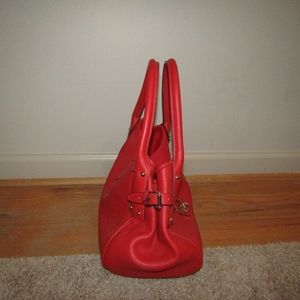 A red Dooney & Bourke purse